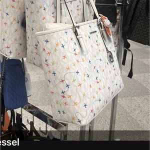 Brand new, Michael Kors, white airplane Jet Set tote Perfect gift for a pilot.